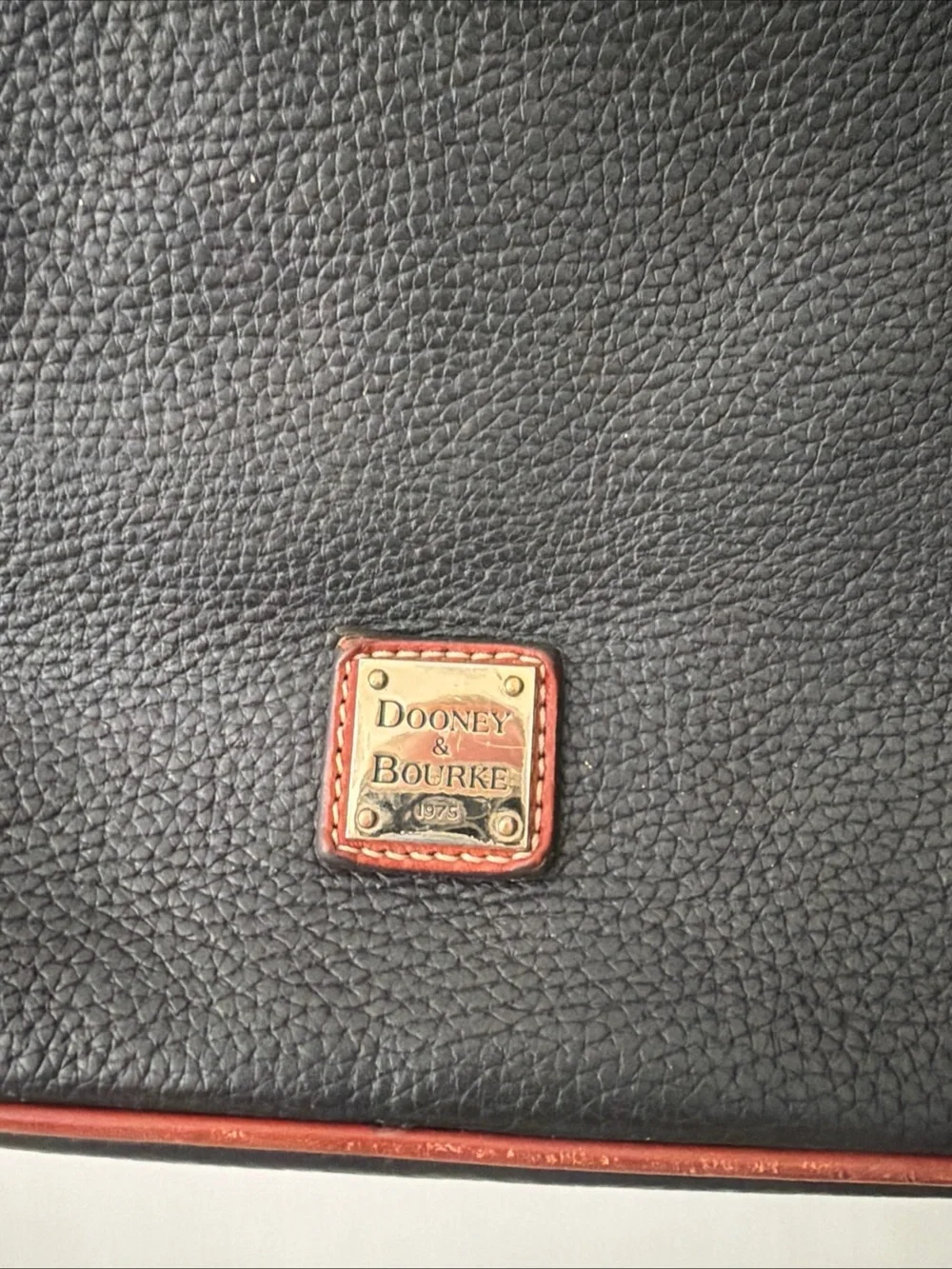 Dooney & Bourke Black Pebbled Leather Crossbody Bag with Brown Trim